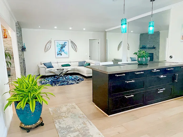 Open concept kitchen equipped with all new stainless steel appliances, breakfast nook, Living room