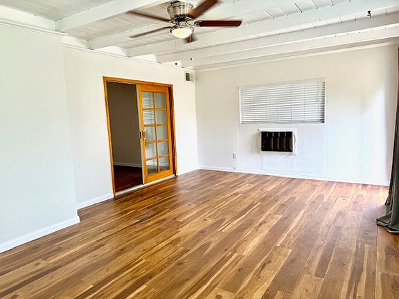 Bright morning room with plenty of natural sunlight and stunning backyard views. This versatile space can easily be converted into an additional bedroom."