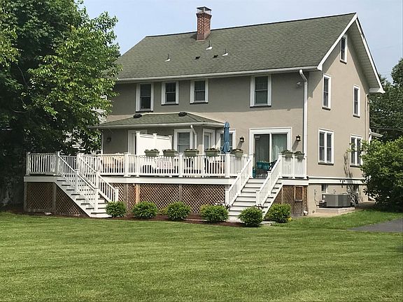 Rear private deck overlooking the beautifully manicured back yard