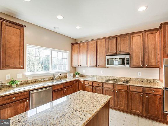 Upgraded cherry cabinets with crown molding