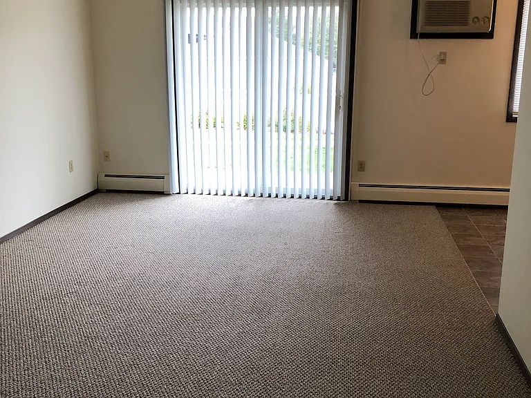 Living room area w/ patio or balcony