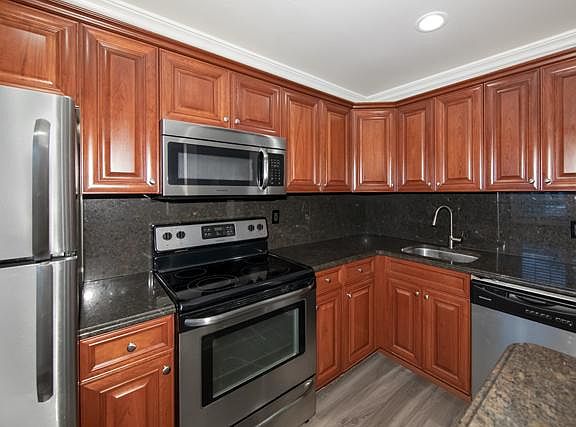 Granite Counters, Tuscany Cabinets, Vinyl Plank Floor