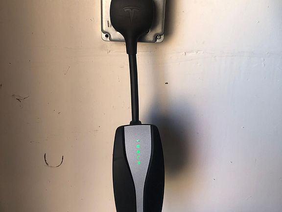 Garage has Tesla/Electric Vehicle Charging Port (NEMA 14-50) Charging cable not included