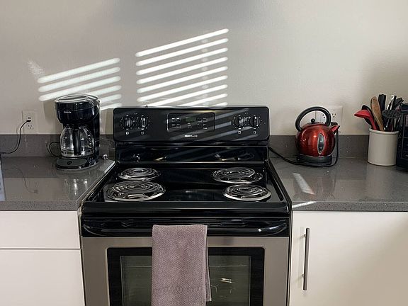 Modern stove and hood for those cooking up a storm at the Bungalow. Coffee pot is here but bring your favorite coffee with you just to make sure that you feel at home in the morning if that is your morning routine...