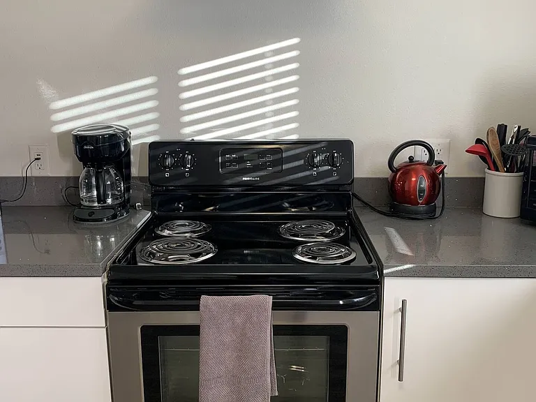 Modern stove and hood for those cooking up a storm at the Bungalow. Coffee pot is here but bring your favorite coffee with you just to make sure that you feel at home in the morning if that is your morning routine...
