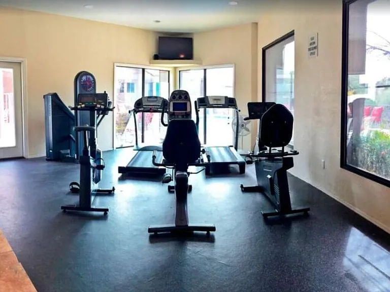 Fitness center overlooking the pool area, short walk from our unit