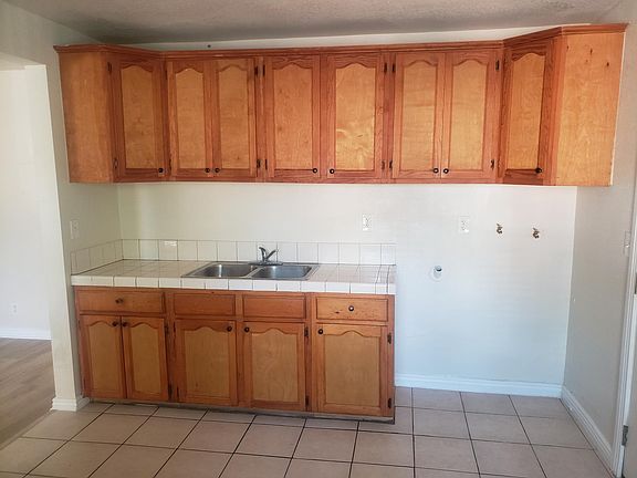 KITCHEN AREA WITH LAUNDRY HOOKUPS
