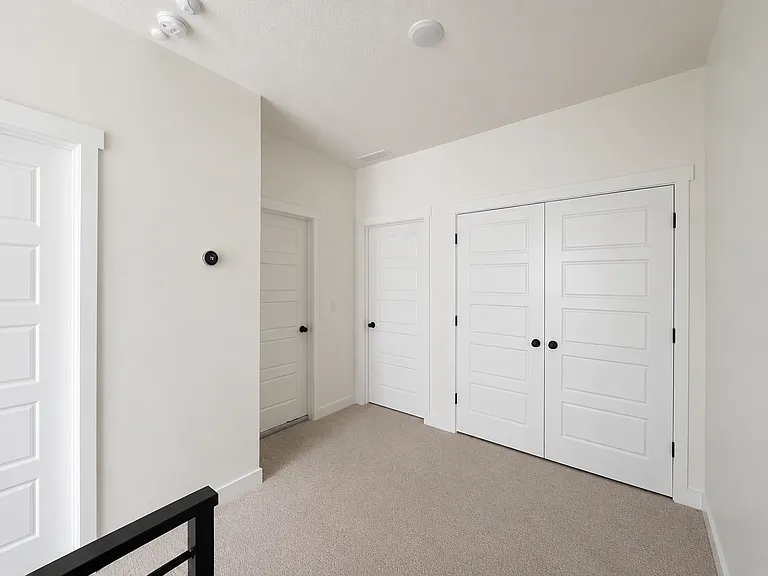 Upstairs hall to 2nd and 3rd bedrooms, full bath and laundry