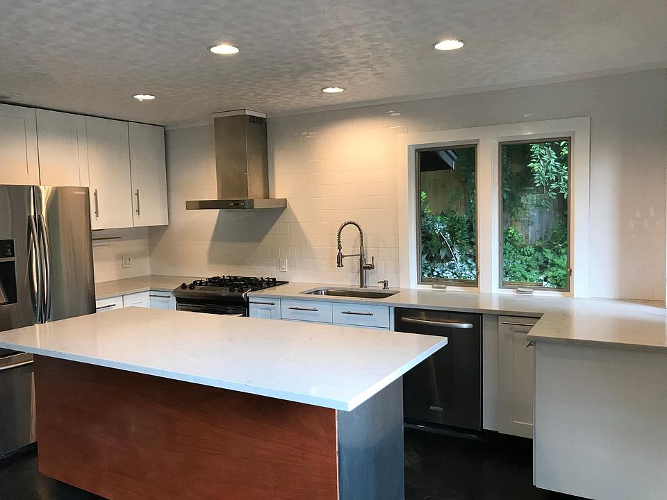 New kitchen with tons of storage/counter space. Island fits