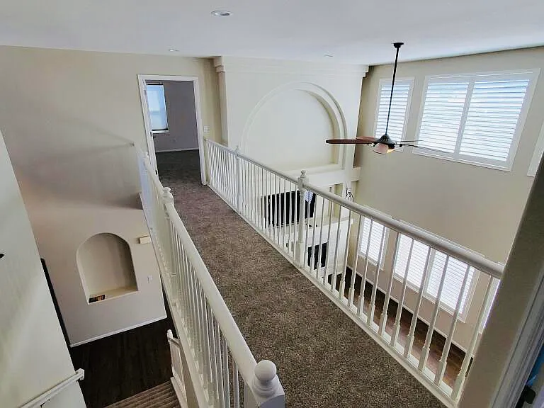 Catwalk leading to master bedroom and ensuite.