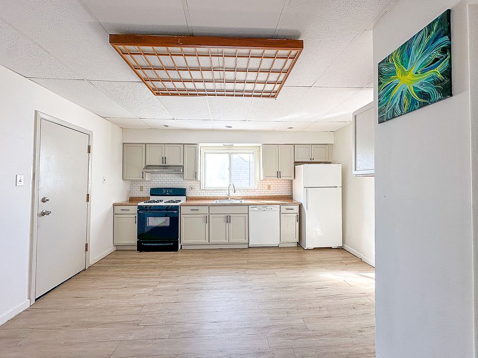 Spacious, bright dining area with large pantry and new range hood