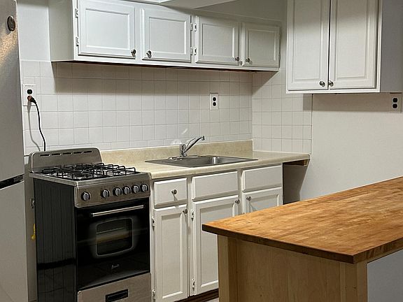 Kitchen with new stove and fridge