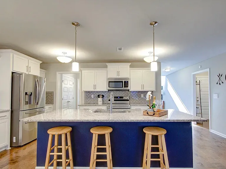 Open kitchen layout with island. All kitchen appliances provided (fridge, stove, oven, microwave, dishwasher, garbage disposal)