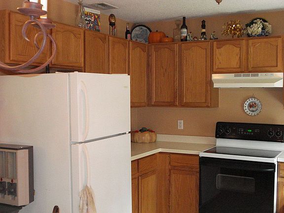 large open kitchen with forrest view window