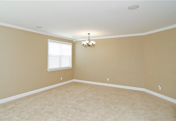 Formal dining room. Wall paint color will vary.