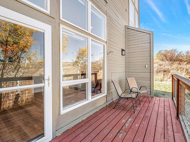 Back deck off living room, with walk out access to grassy area
