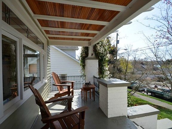 Charming front porch showing the beautiful wood soffits and leaded glass. Yes that is Green Lake just 2 blocks away.