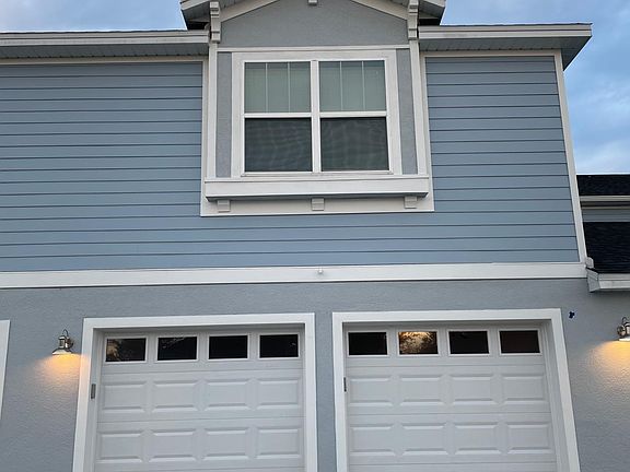 Outside view of apartment. Above garage