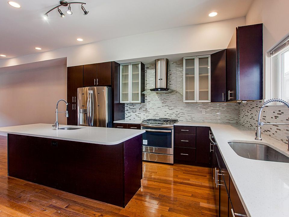 Gourmet kitchen with two sinks and wine cooler