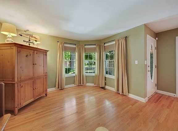 Living Room has hardwood floors, would also make a good home office, guest room or hide away. Bank o