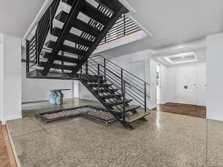 View of Foyer, stairwell and custom serving table