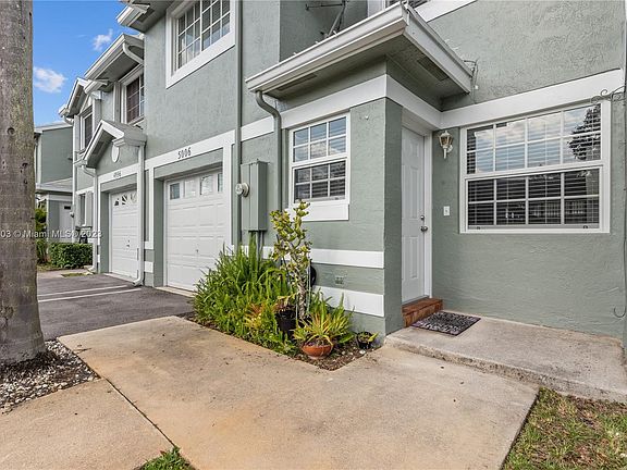 Private walkway to enter your townhome, with exterior lighting.