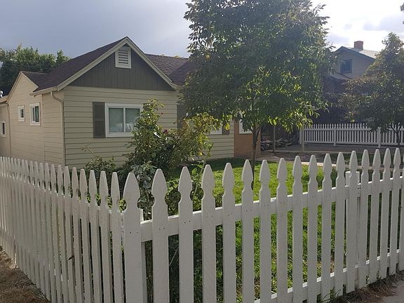 Fenced yard with trees in a family friendly tree-lined neighborhood