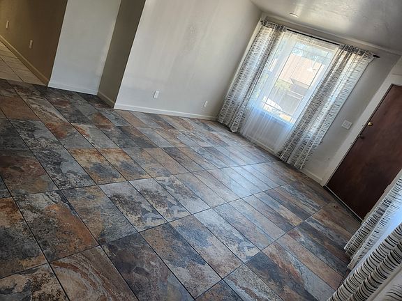 extra-large living area can serve dual or triple purpose lounge are, WFH with desk, and reading nook