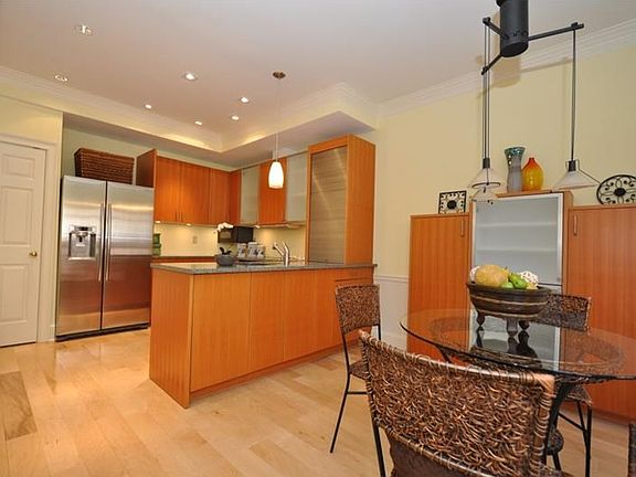 Intimate breakfast area with built-in china and glassware storage