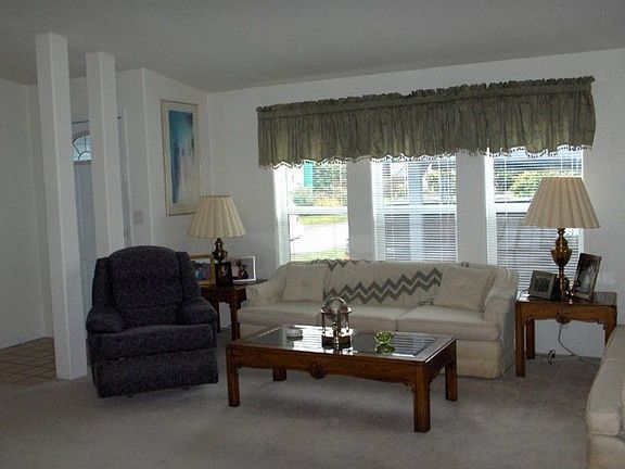 Gorgeous living room with huge picture windows.