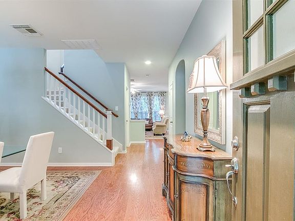 Welcome home! As you enter the door you are greeted by expansive wood floors and attractive architectural features.