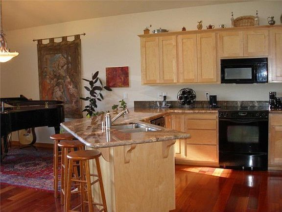 Kitchen designed with the Chef in mind....lots of granite, tons of strorage, bar area too!