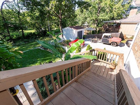 Stairs from covered deck to lower covered patio