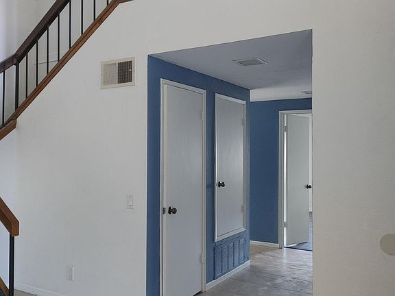 Hallway to downstairs bedroom