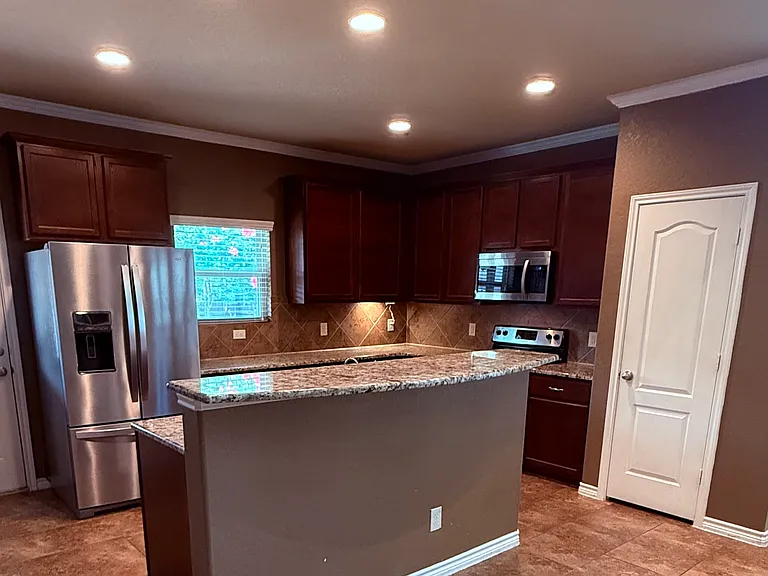 Beautiful practical design and granite countertops combine with design elegance. The pantry hold lots of goodies to throw a party