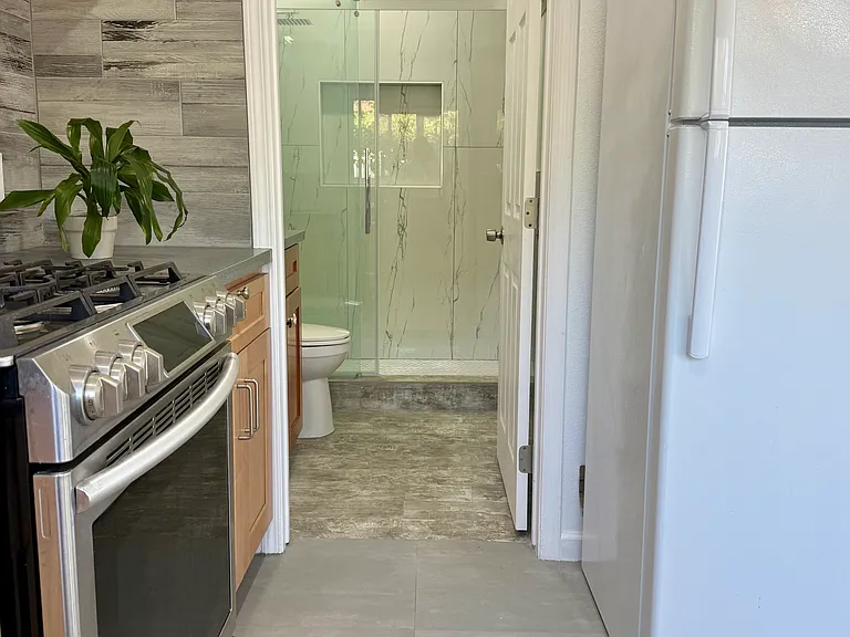 Brand new bathroom is located adjacent to the kitchen.