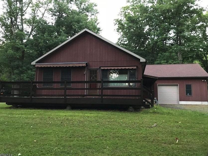 Large deck with view of garage.