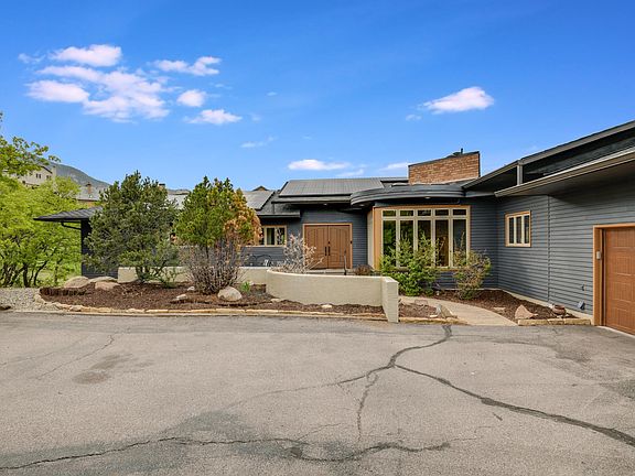 Large flagpole lot accommodates extra parking and basketball hoop.