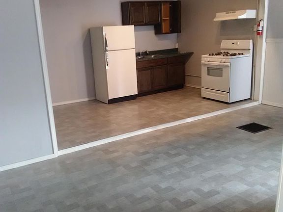 Kitchen has open concept to the living room, New vinyl tile in the kitchen and living room, smoke detectors direct wired,fire extinguisher