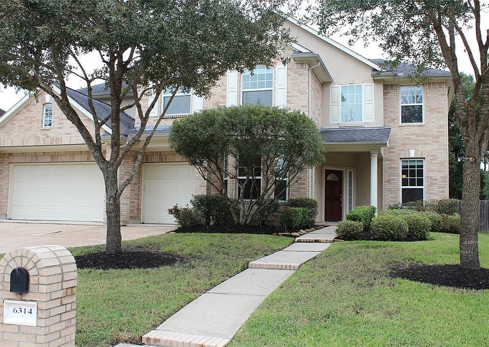 Beautiful curb appeal with brick front and 3 car garage.