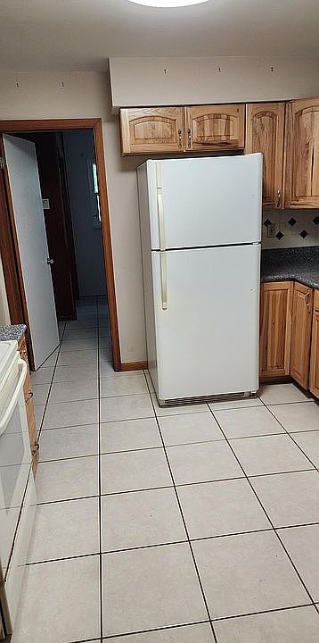 Kitchen looking into laundry