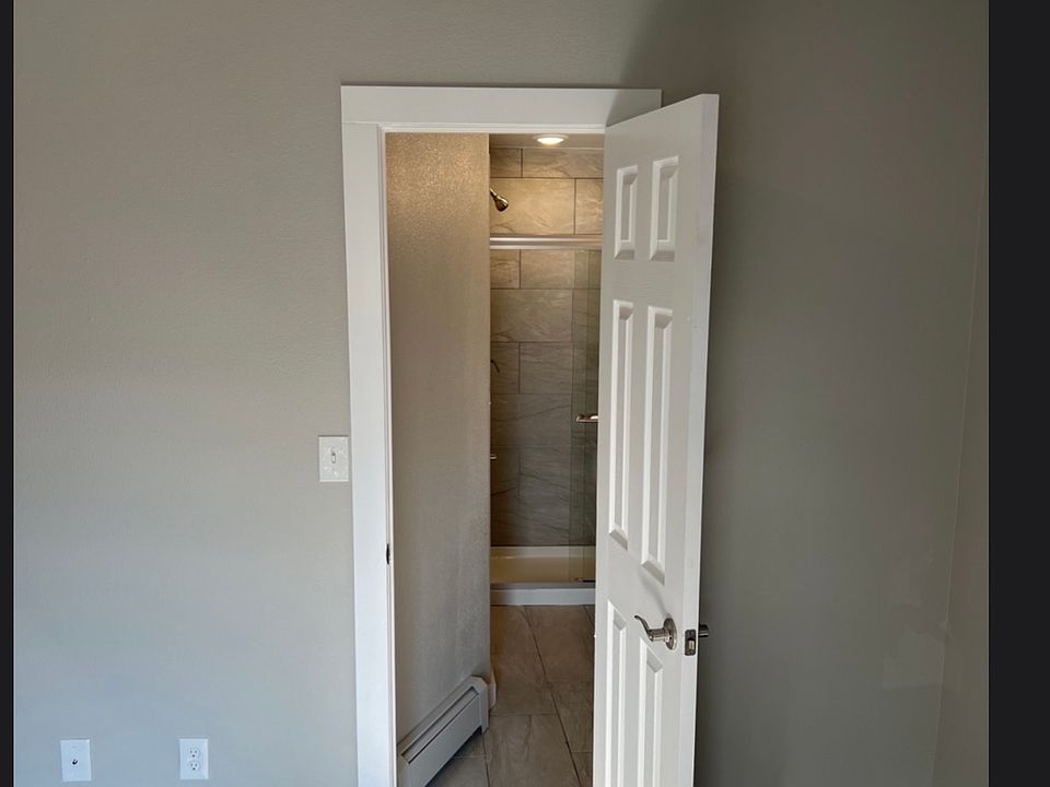 LOOKING TOWARD BATHROOM FROM LIVING ROOM