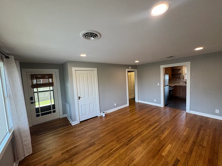 Living room with door to front porch