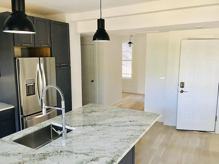 Den off of kitchen (sliding barn door has been added)