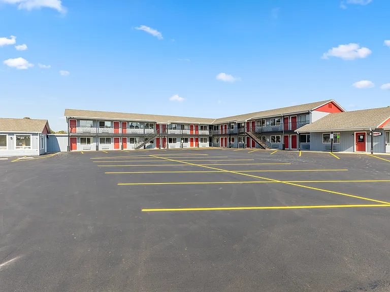 Clean, attractive exterior with ample off-street parking for residents and guests.