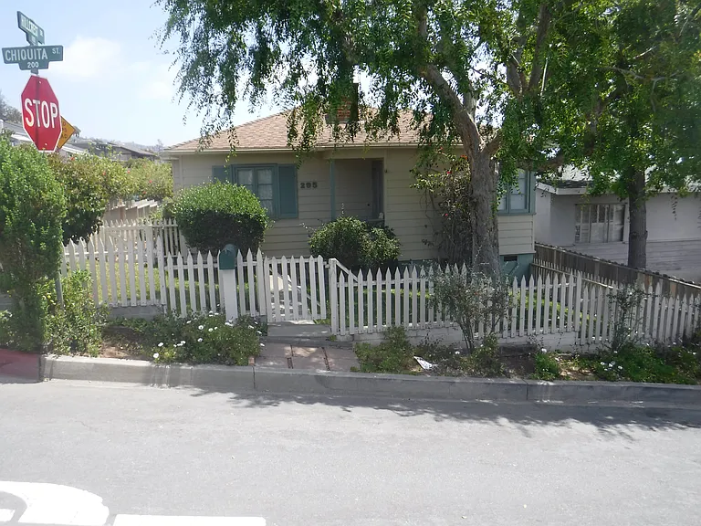 Front of the house. Grass lawn.
