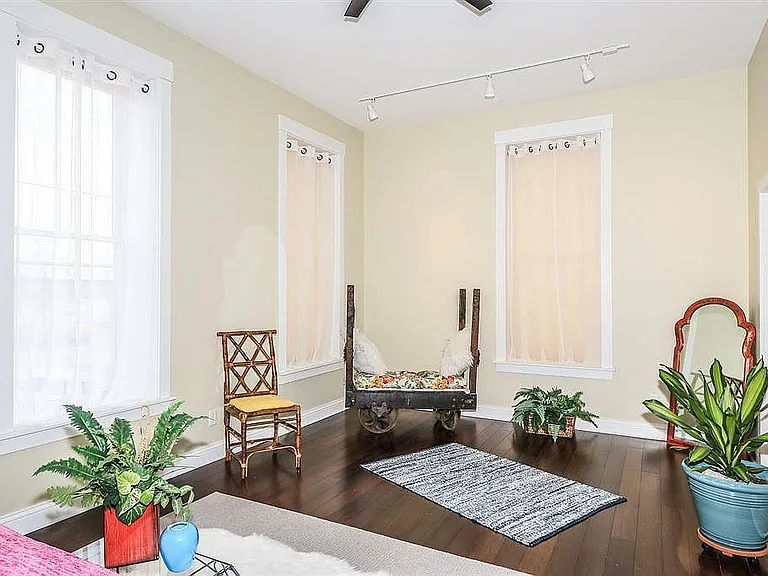 Second Floor main bedroom suite overlooks views of the river, large windows let in lots of natural light!