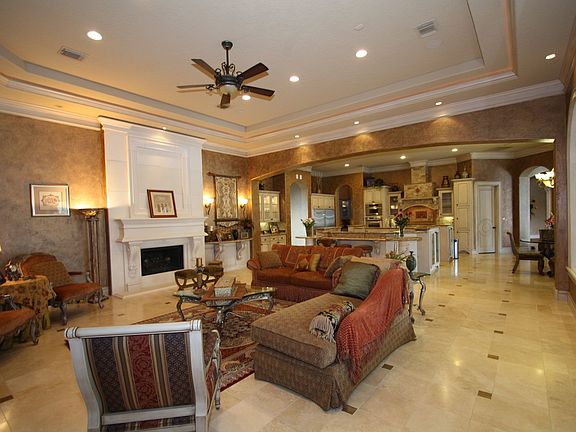 Travertine floors throughout most of the downstairs into this glamourous den.