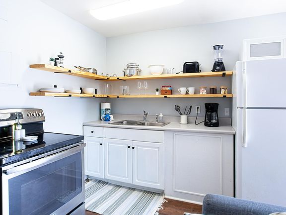 Well stocked kitchen (dishware, pots/pans, coffee pot, and more)