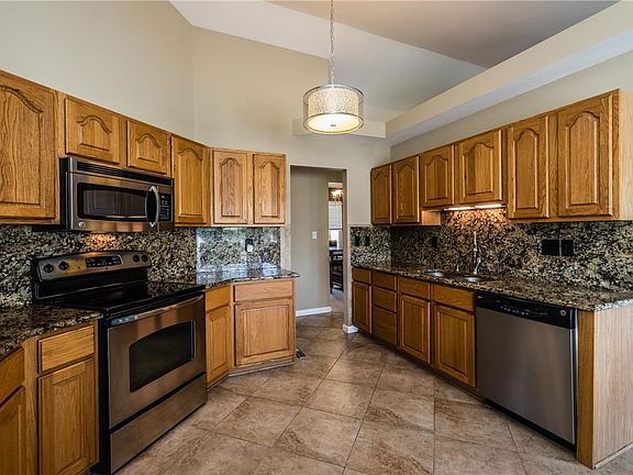 Ceramic tile floors and stainless steel appliances